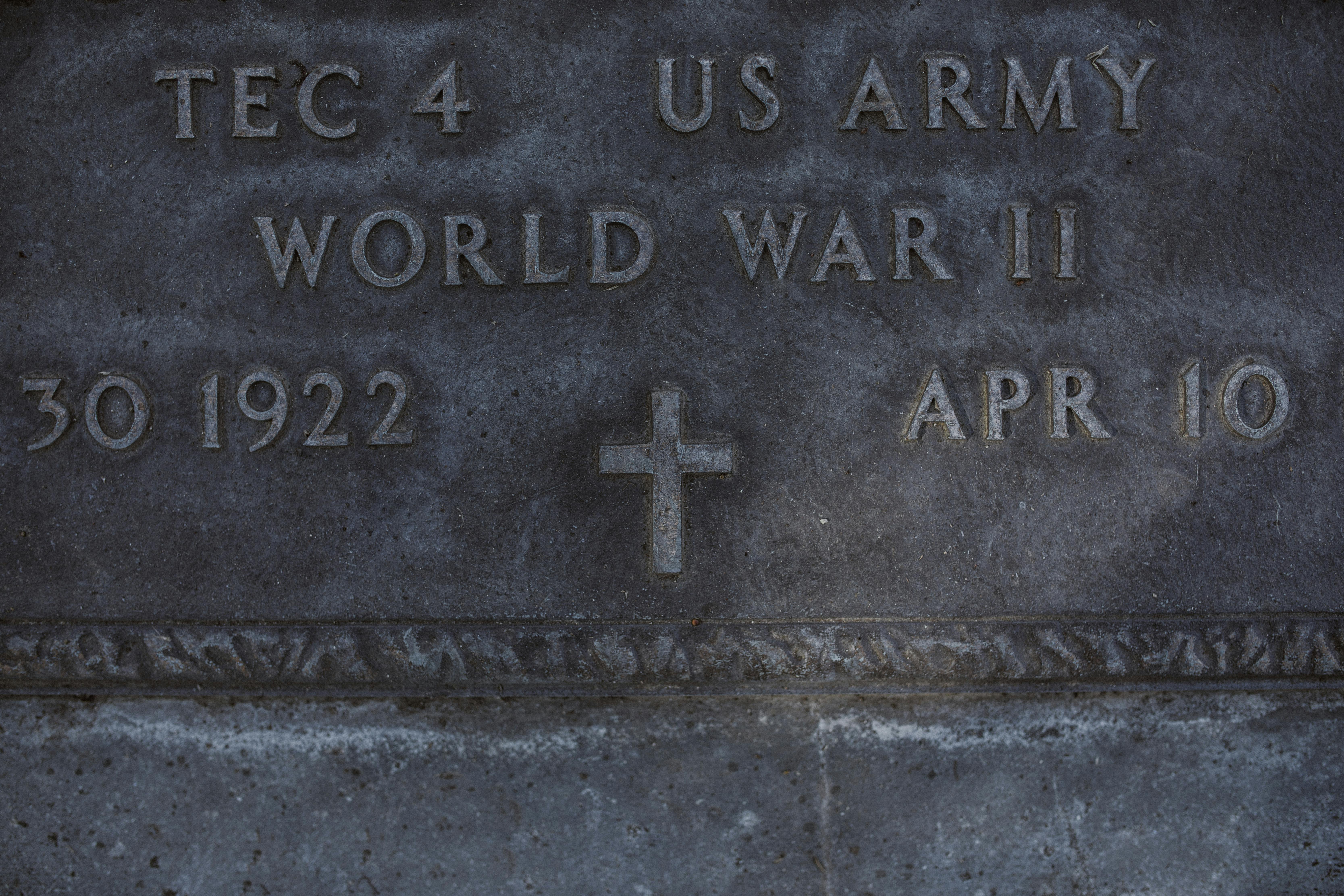 engraved epitaph on gray tombstone