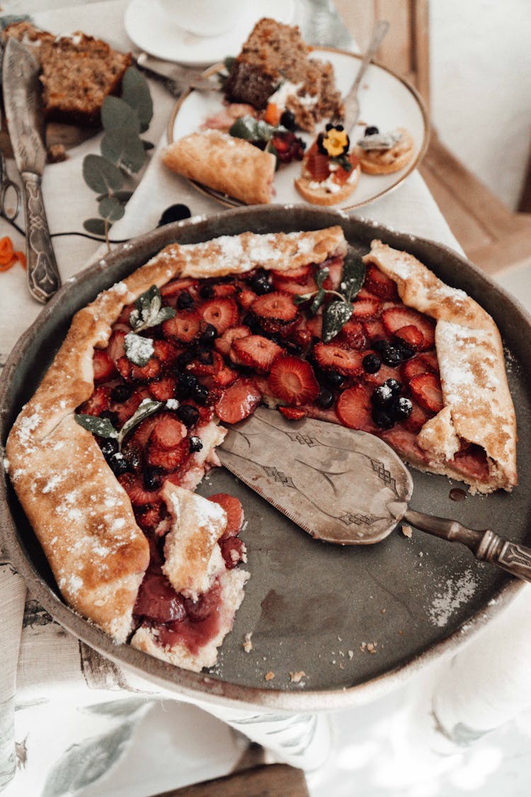 Tasty Berry Pie In Baking Pan With Spatula