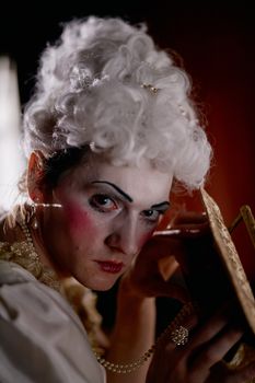Portrait of a woman in Victorian costume applying makeup, artfully lit.. portrait, woman, victorian