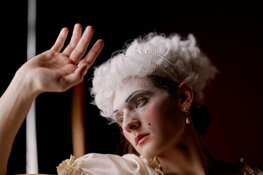 Portrait of a woman in historic costume, capturing elegance and theatrical flair.