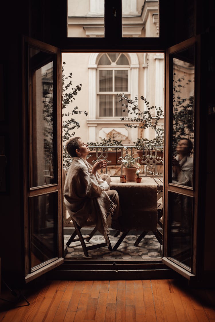 Dreamy Woman With Coffee On Balcony At Home