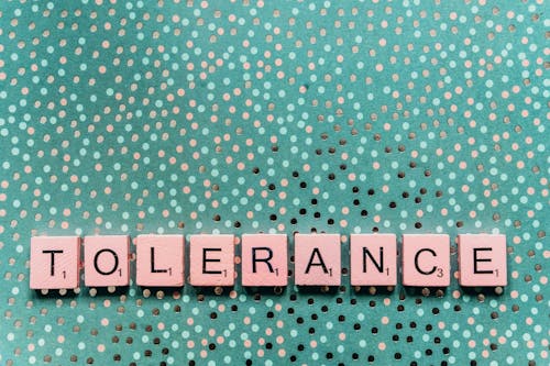 Free Tolerance Word in White Scrabble Tiles Stock Photo