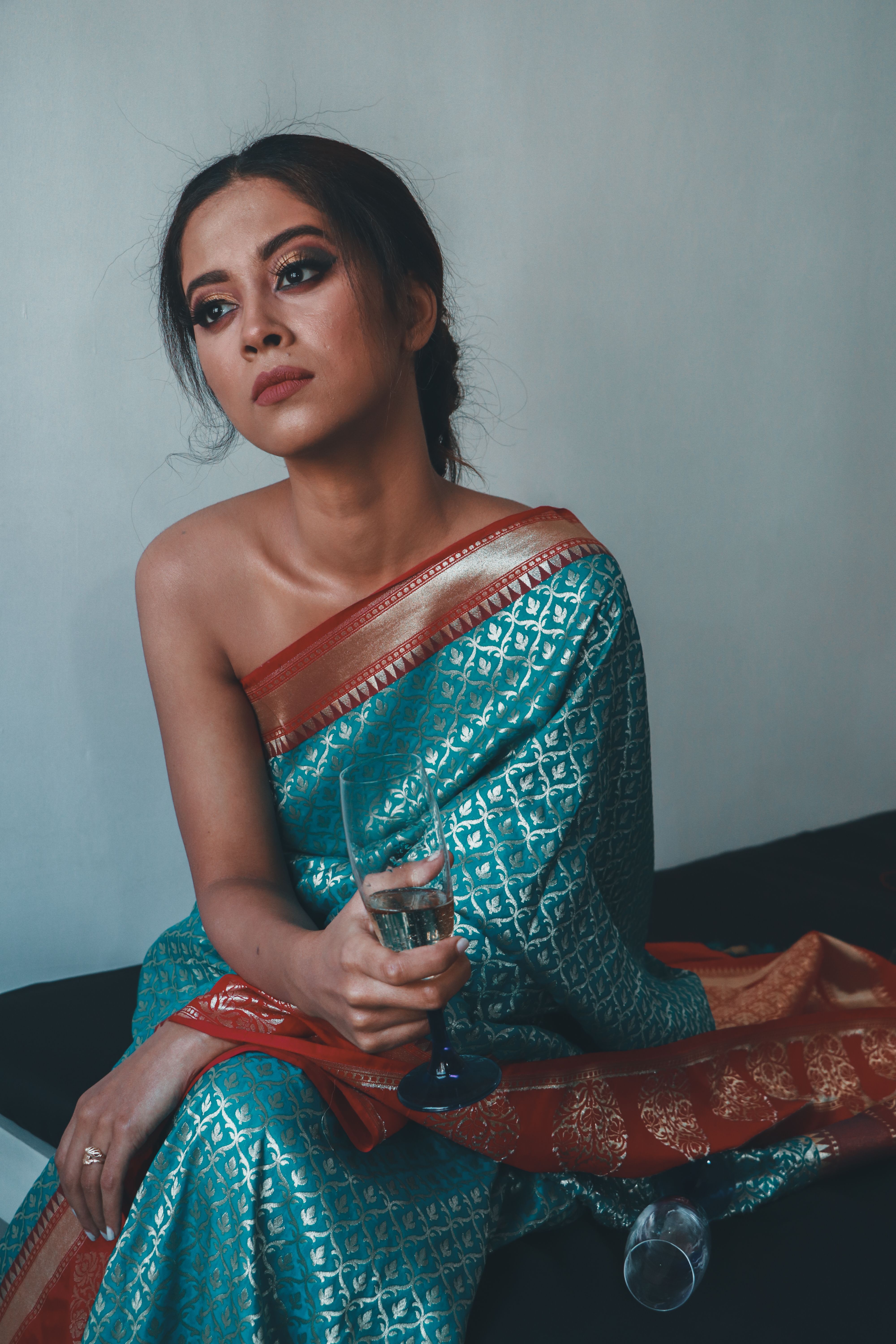 Woman in Blue Saree Lying on a Tree Trunk · Free Stock Photo