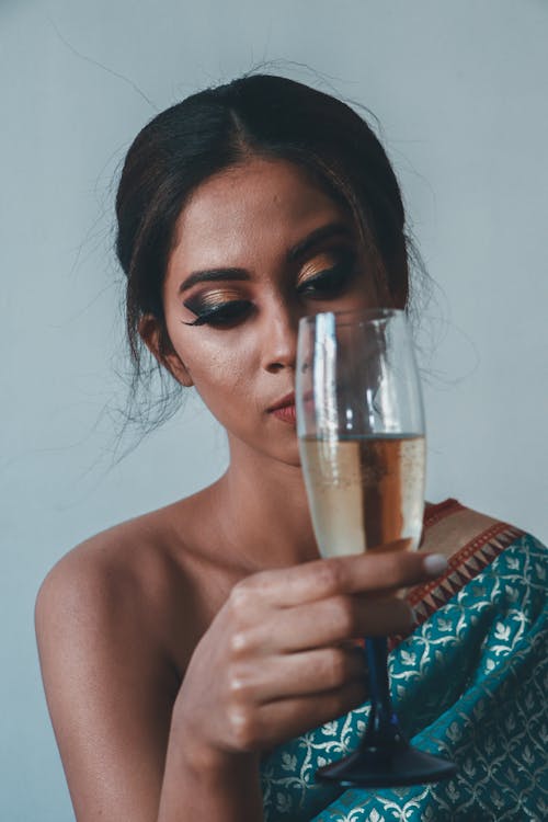 Person Holding a Champagne Glass