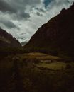 Green and Brown Mountains Under Cloudy Sky
