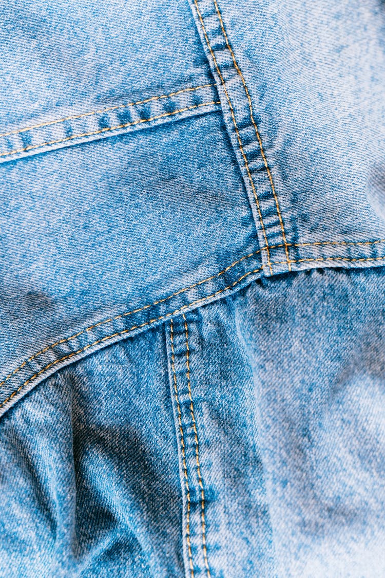 Blue Denim Fabric With Seam In Close Up Photography