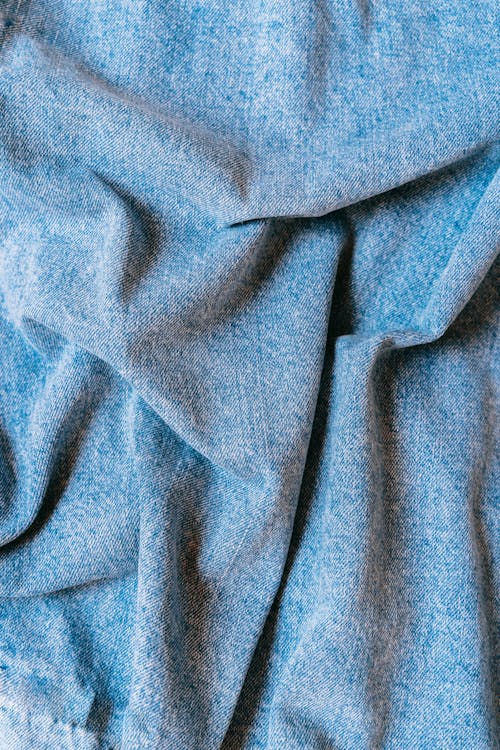 Blue Denim Textile in Close Photography