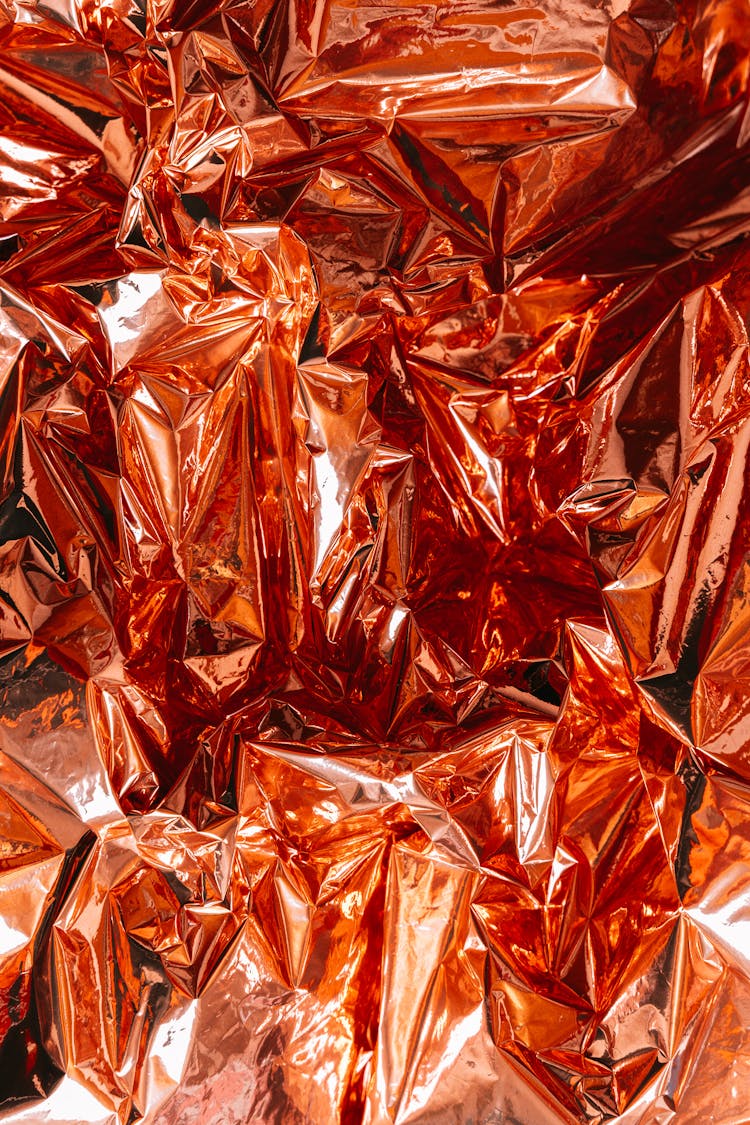 Close-up Of A Wrinkled Red Foil 