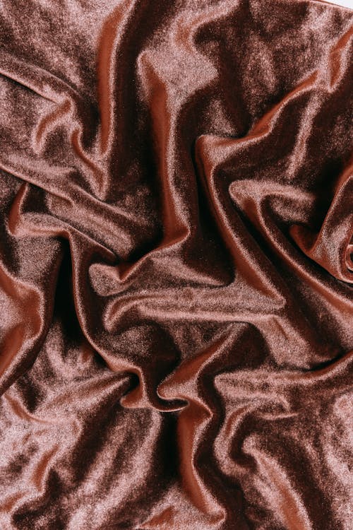 Top View of a Red Creased Shiny Textile