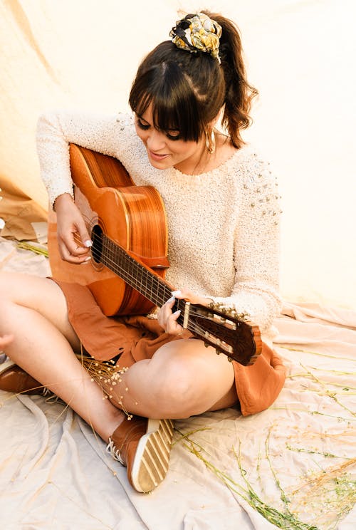 Free Woman Playing Acoustic Guitar Stock Photo