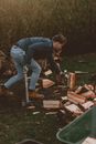 Man with axe and firewood in countryside