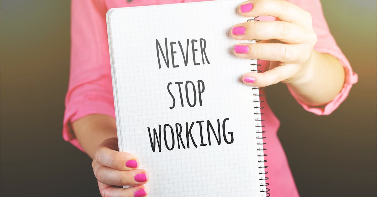 Woman Holding Never Stop Working Print Notebook