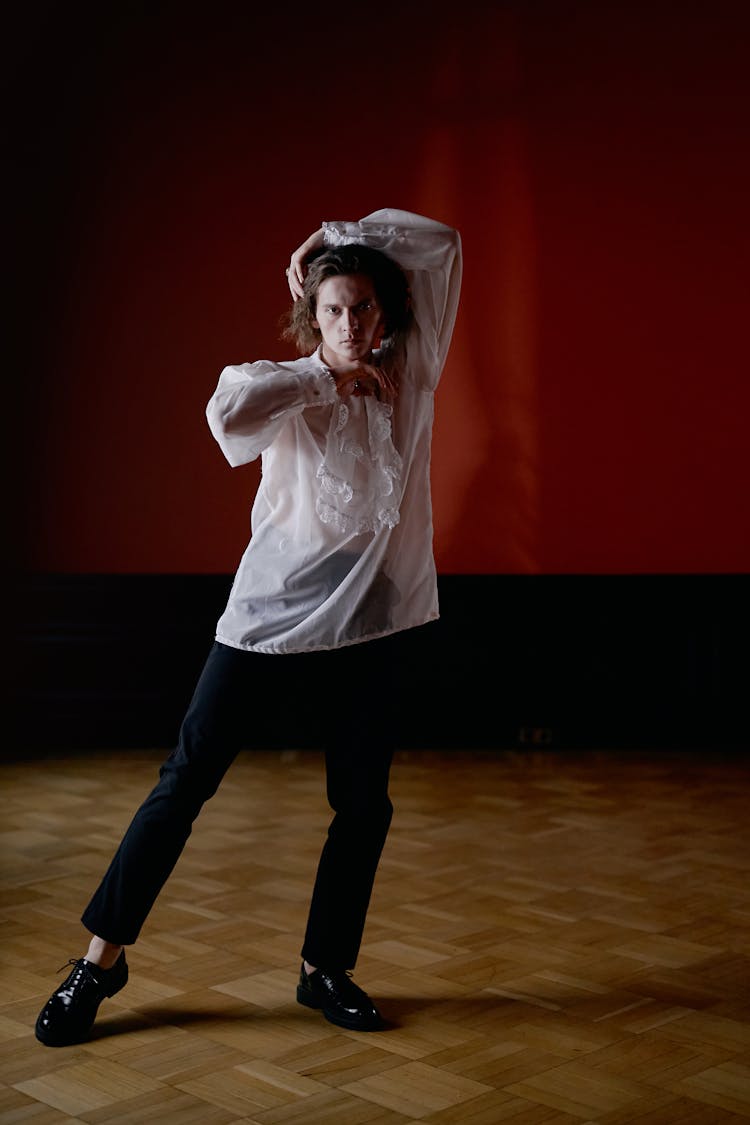 Man Wearing Frill Shirt In White Linen And Black Pants