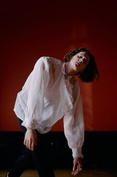 Woman in White Long Sleeve Shirt and Black Pants