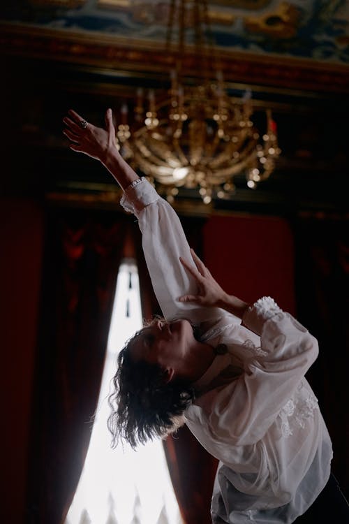 Photo of a Man with Long Hair Dancing