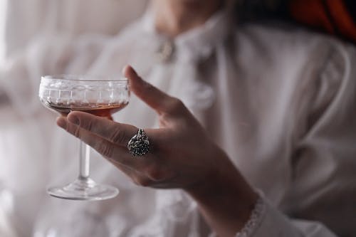 Free Close Up Shot of a Person Holding a Wine Glass Stock Photo