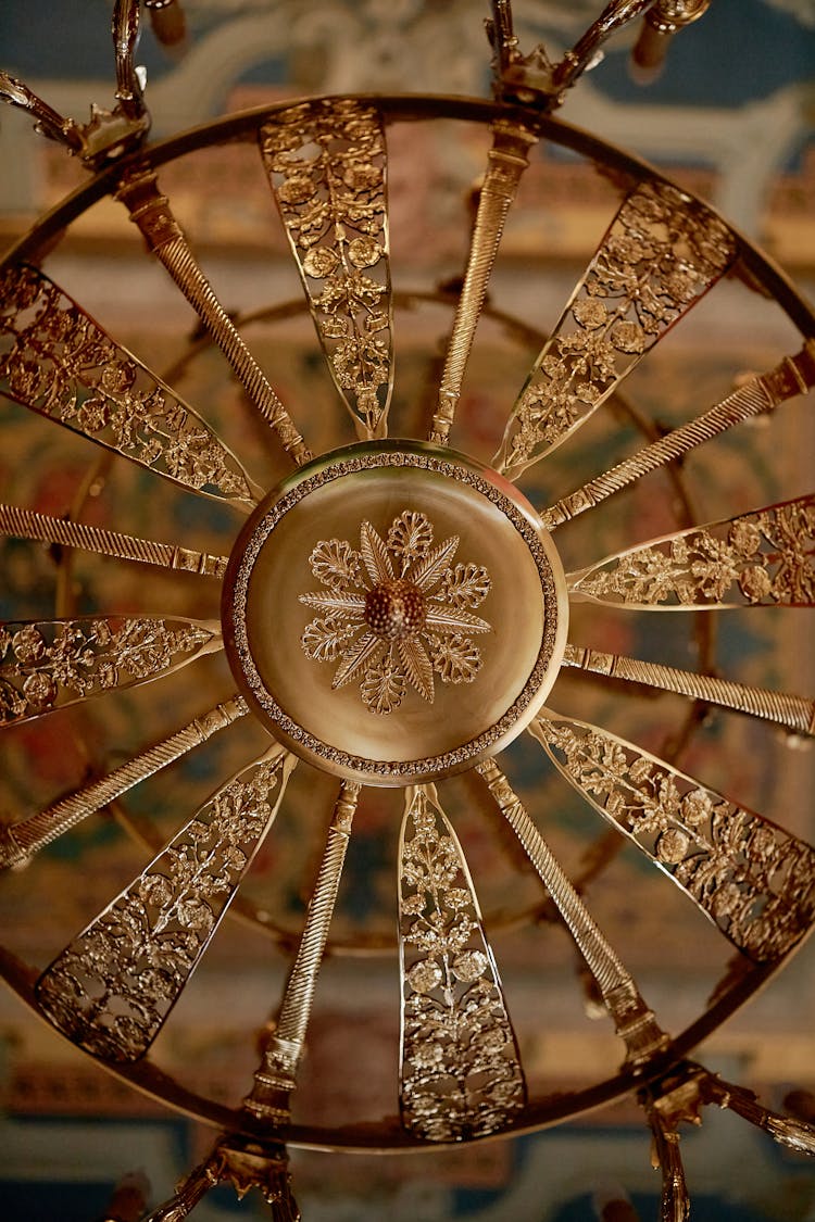 A Gold Round Floral Decoration In Close-up Shot