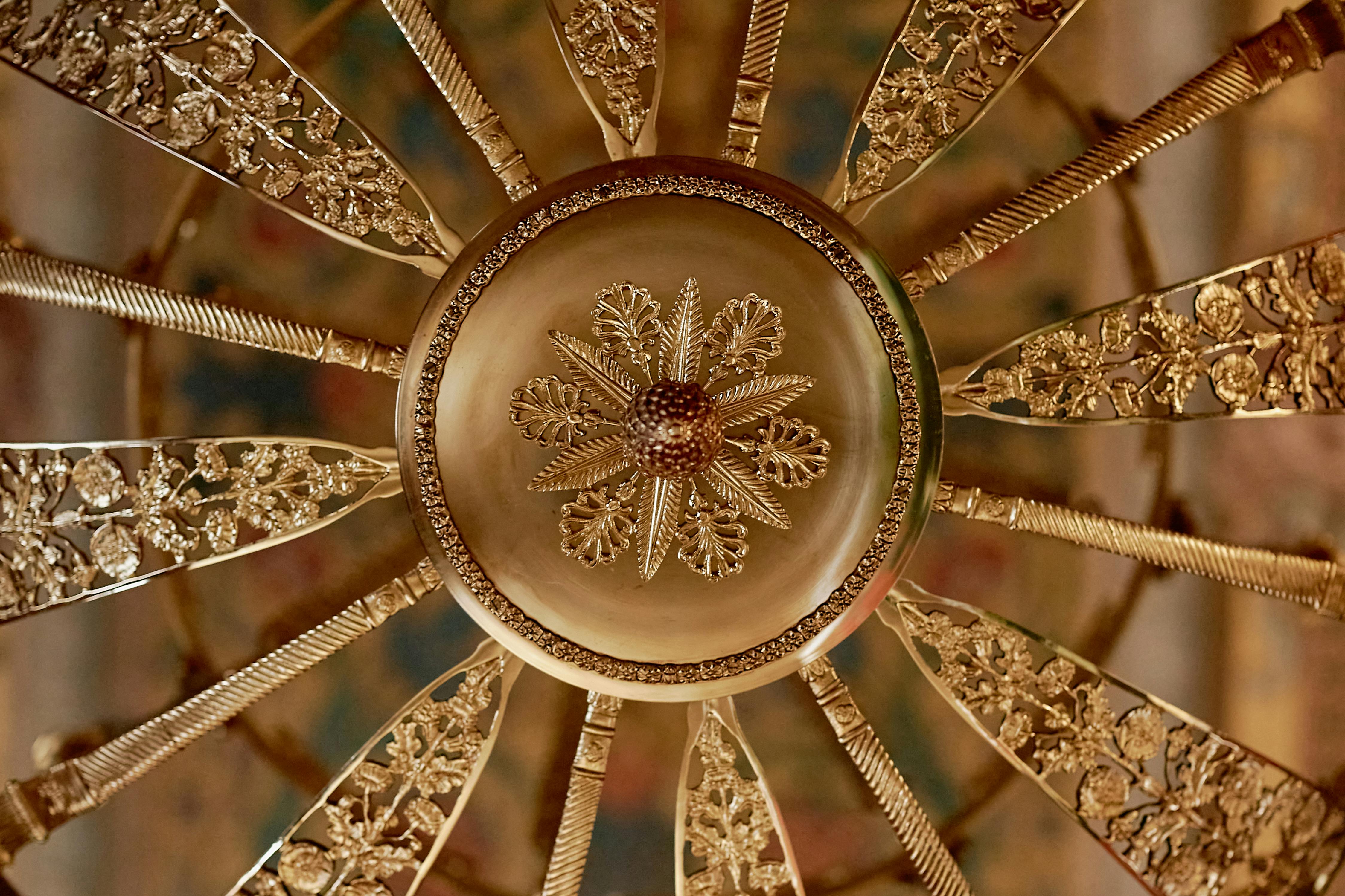 a round gold floral design in close up shot