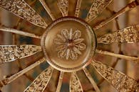 A Round Gold Floral Design in Close-up Shot