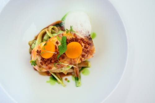 Top View of a Delicious Food Topped with Egg Yolks and Alfa Ala Sprouts