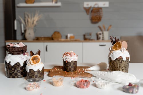 Delicious Desserts with Icing on White Table