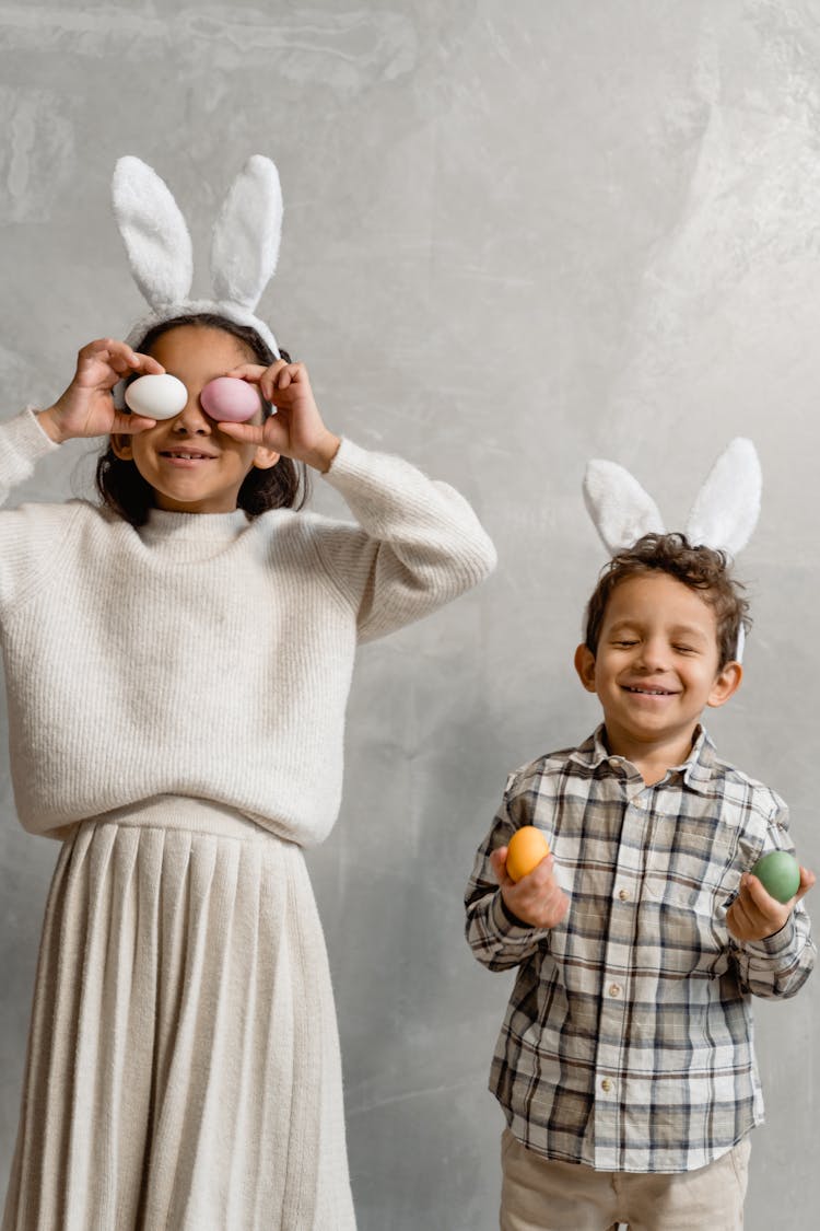 Kids With Bunny Ears Holding Eggs 