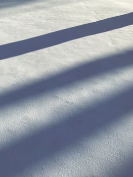 Artistic shadows cast on a textured surface, offering abstract visuals with a soft play of light.