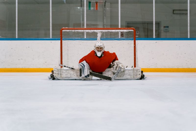 Jonas Weber stretching across the crease for a save