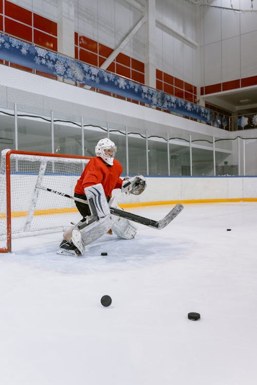 Man Guarding a Hockey Goal Cage