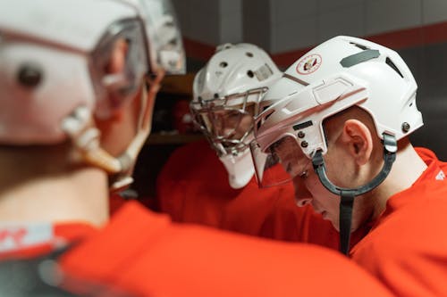 Hokey Players in White Helmets