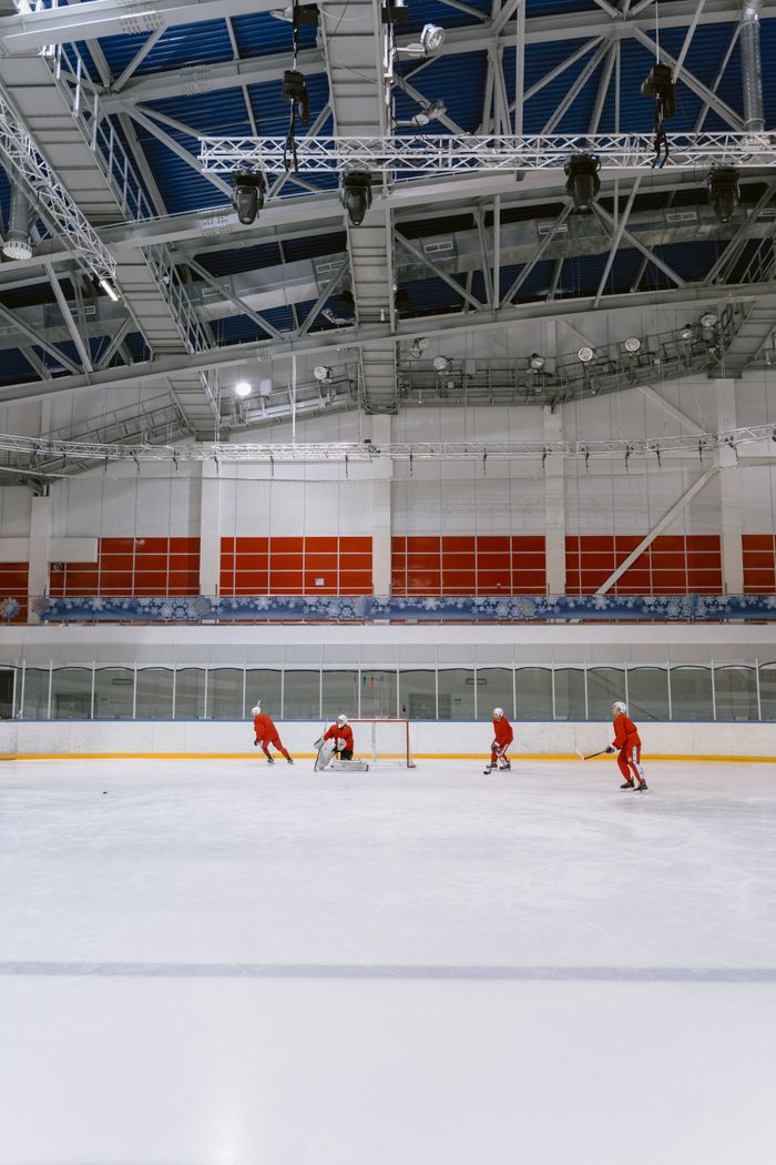 Squad running a passing drill in the arena