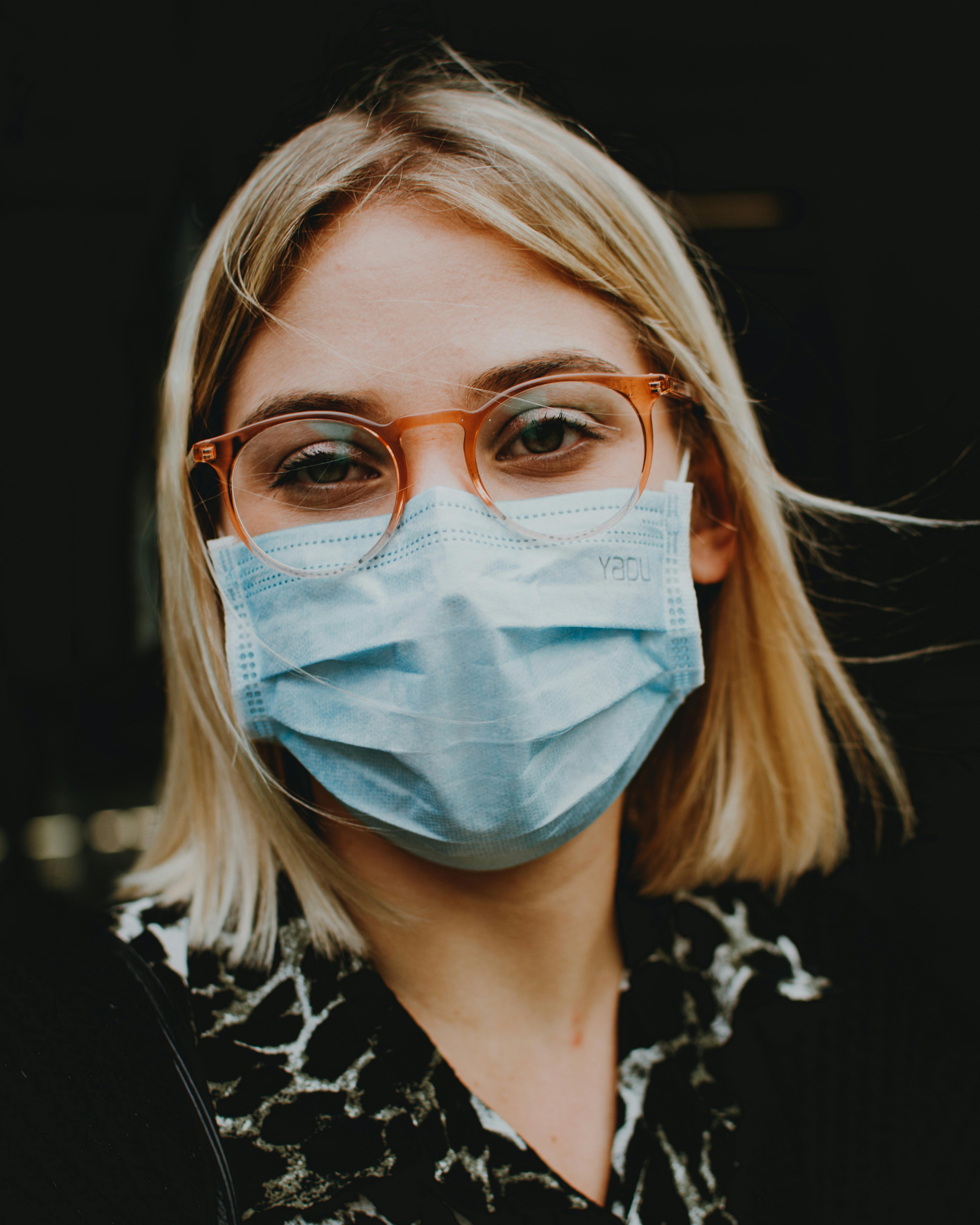 woman wearing medical mask on street