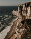 Rocky cliff near rippling sea