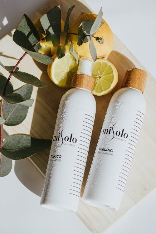 Misolo Cosmetics Products Lying on a Board with Eucalyptus Leaves and Lemon 