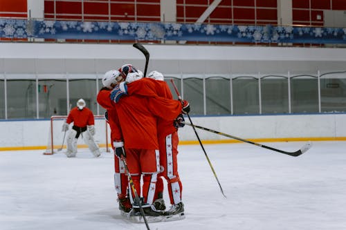 Hockey Players Hugging Together