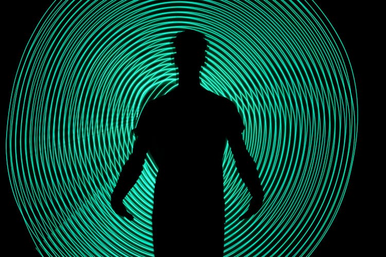 Green Circle Behind Man Silhouette