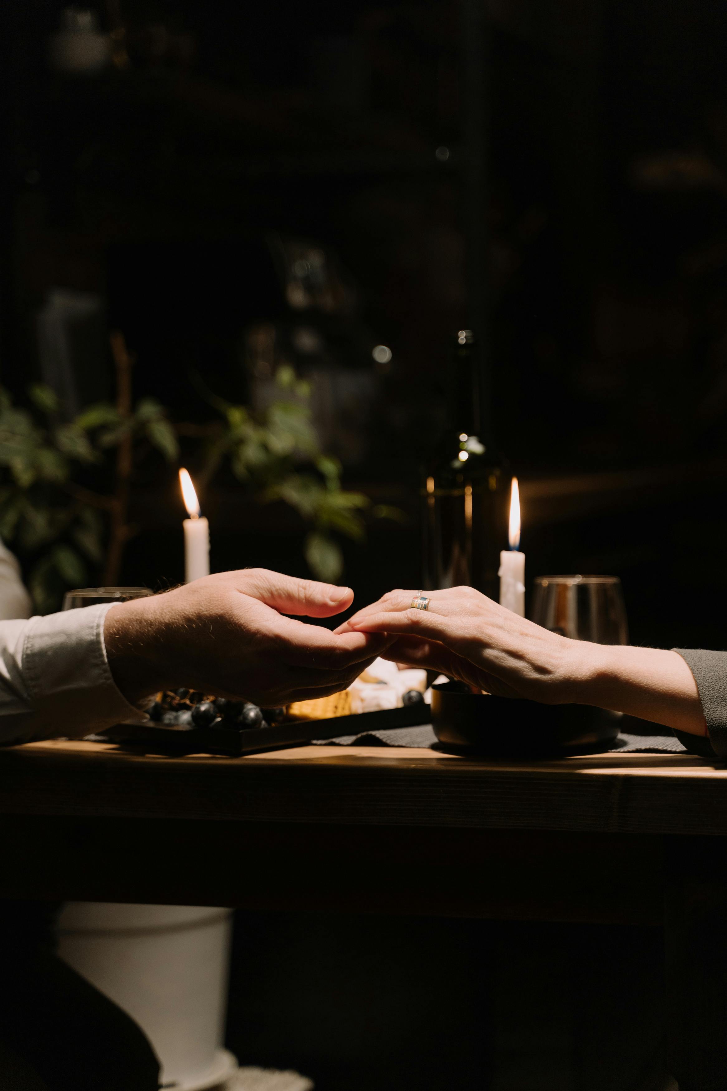 a close up shot of a couple holding hands