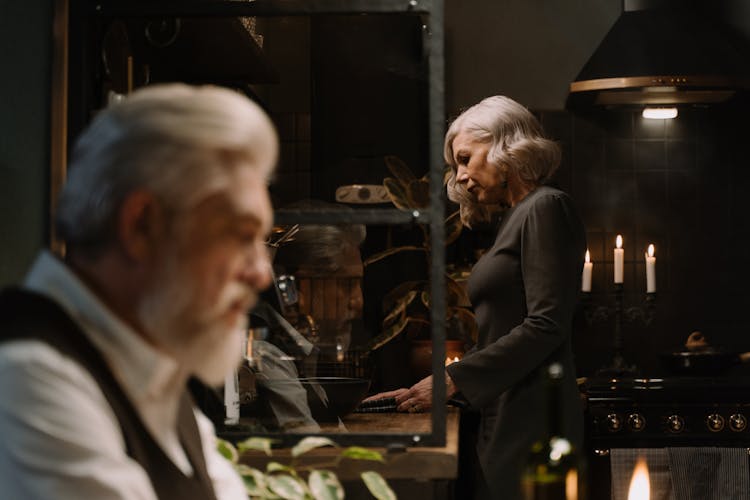 Couple Cooking In Kitchen