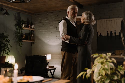 An Elderly Couple Dancing at Home