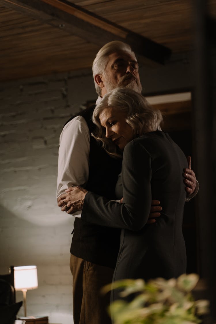 An Elderly Couple Hugging Each Other