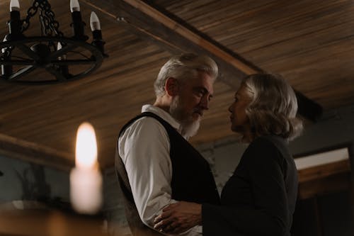 Free An Elderly Couple Dancing Close to Each Other Stock Photo