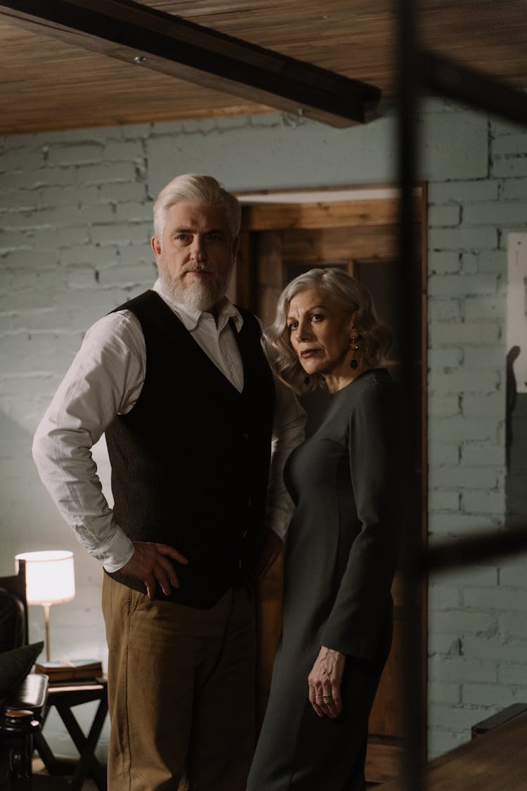 Elegant Elderly Couple Standing In Doorway Of Industrial House