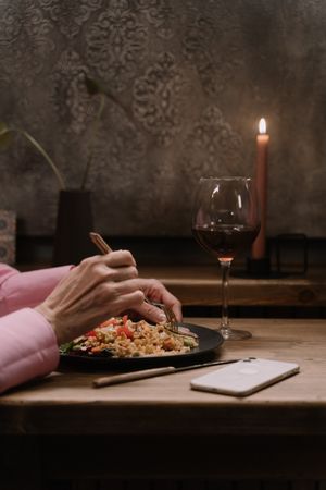 Candlelit dinner with a glass of red wine — photo by cottonbro studio on Pexels