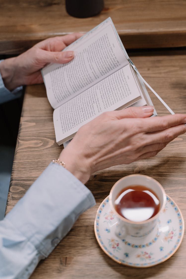 A Person Holding A Book