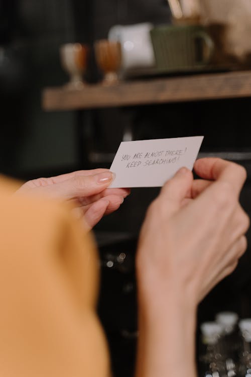 A Person Holding a Note