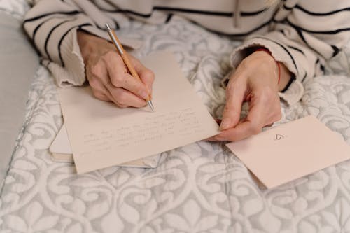A Person Writing a Letter 