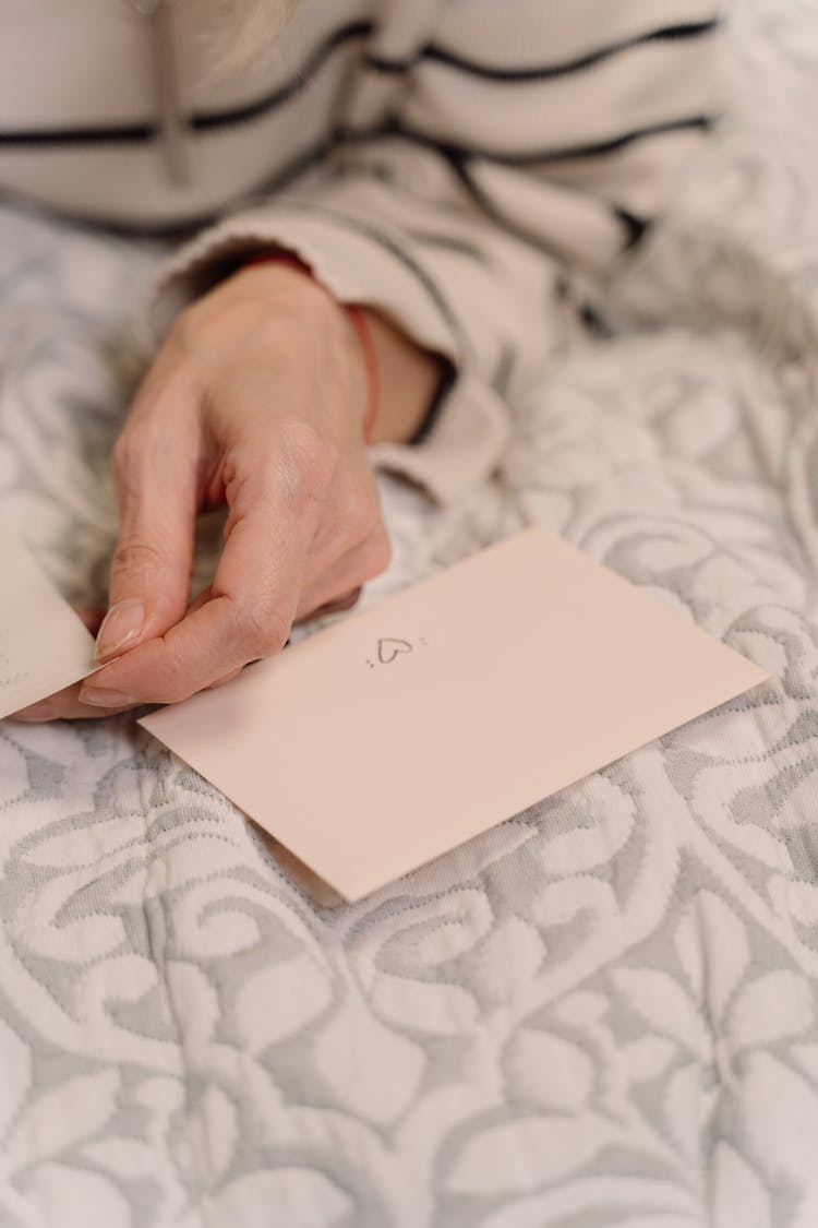 Folded Paper Near The Person's Hand 