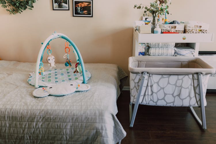 Baby Crib Beside A Bed