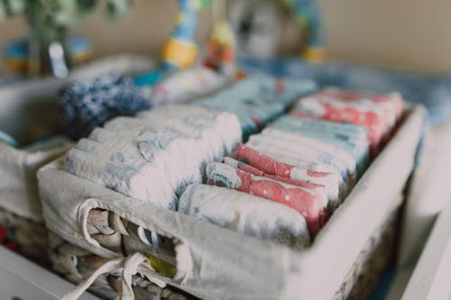 Free Organized Diapers on Woven Basket Stock Photo