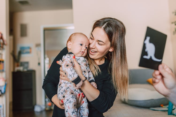 Adorable Baby Looking At The Baby Flash Card